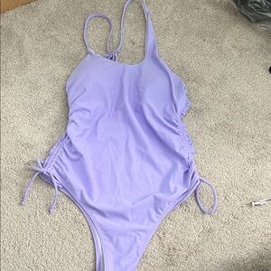 Brand new never worn lavender one piece. Size M